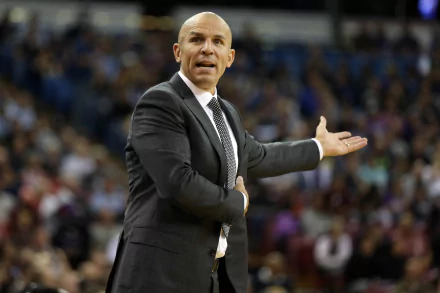 HD desktop wallpaper featuring a man in a suit coaching on a basketball court, expressing a strategy with an outstretched hand.