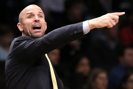 HD desktop wallpaper featuring a man in a suit pointing emphatically during a basketball game.