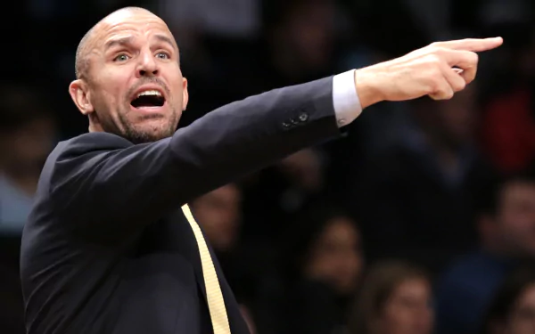 HD desktop wallpaper featuring a man in a suit pointing emphatically during a basketball game.