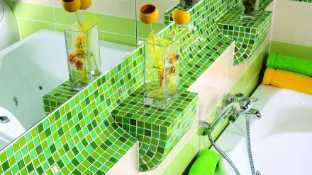 A vibrant bathroom scene featuring green mosaic tiles, a stylish sink with a glass vase, and bright towels, designed as a high-definition PC wallpaper and background.