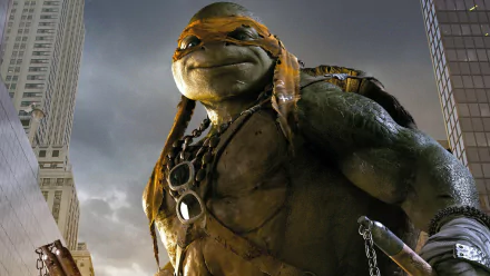 HD wallpaper featuring Michelangelo from the Teenage Mutant Ninja Turtles movie (2014), showcasing the iconic character against a city backdrop.