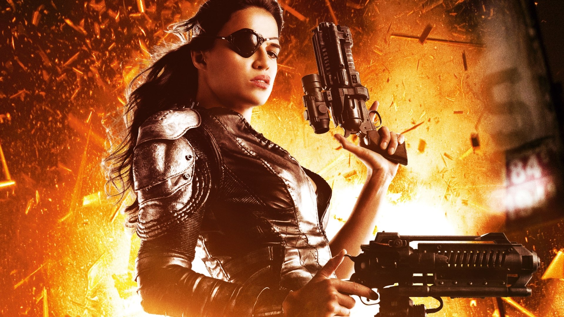 HD PC desktop wallpaper featuring a fierce female character from the movie Machete Kills, armed and set against a fiery explosion background.
