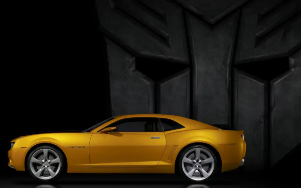 HD desktop wallpaper of a yellow sports car from the Transformers movie, positioned against a dark backdrop with a large robotic silhouette.