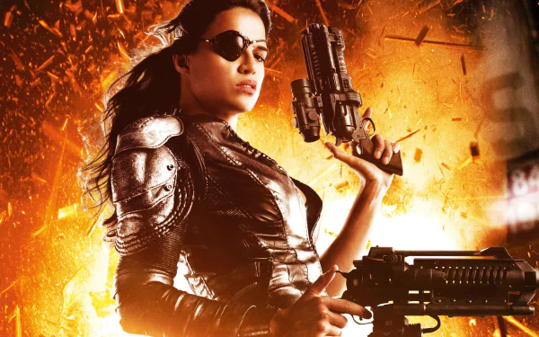 HD PC desktop wallpaper featuring a fierce female character from the movie Machete Kills, armed and set against a fiery explosion background.