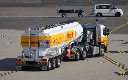 Shell VIP Jet tanker refueler at an airport apron — white-and-yellow fuel truck on the tarmac, HD PC desktop wallpaper and background.