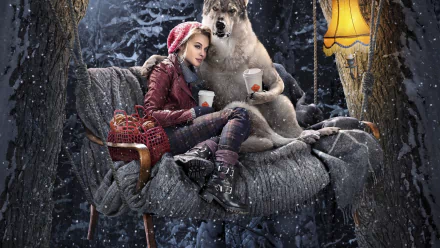 A fantasy scene featuring a woman in a red riding hood, sitting with a wolf on a cozy chair amidst a snowy forest, illuminated by a warm lamp. Perfect HD wallpaper for a desktop background.