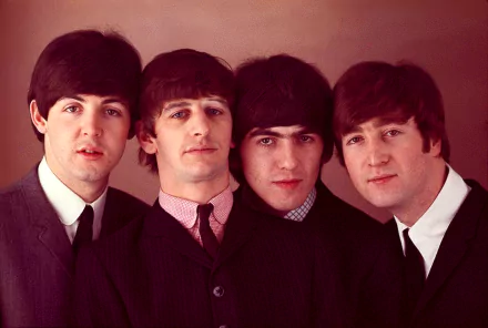 Classic HD wallpaper featuring The Beatles, showcasing the iconic band members in suits, capturing the essence of 1960s music culture.