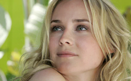 HD desktop wallpaper featuring a close-up portrait of celebrity Diane Kruger with a soft green background.