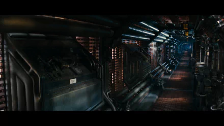 HD PC desktop wallpaper depicting a dark, industrial sci-fi corridor from the movie Alien, featuring detailed pipes and mechanical elements, evoking a tense, eerie atmosphere.