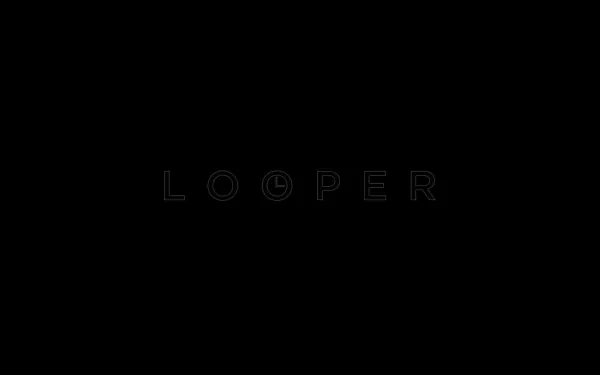 HD PC desktop wallpaper: minimalist black background with a faint outlined LOOPER movie title centered as a subtle cinematic backdrop.