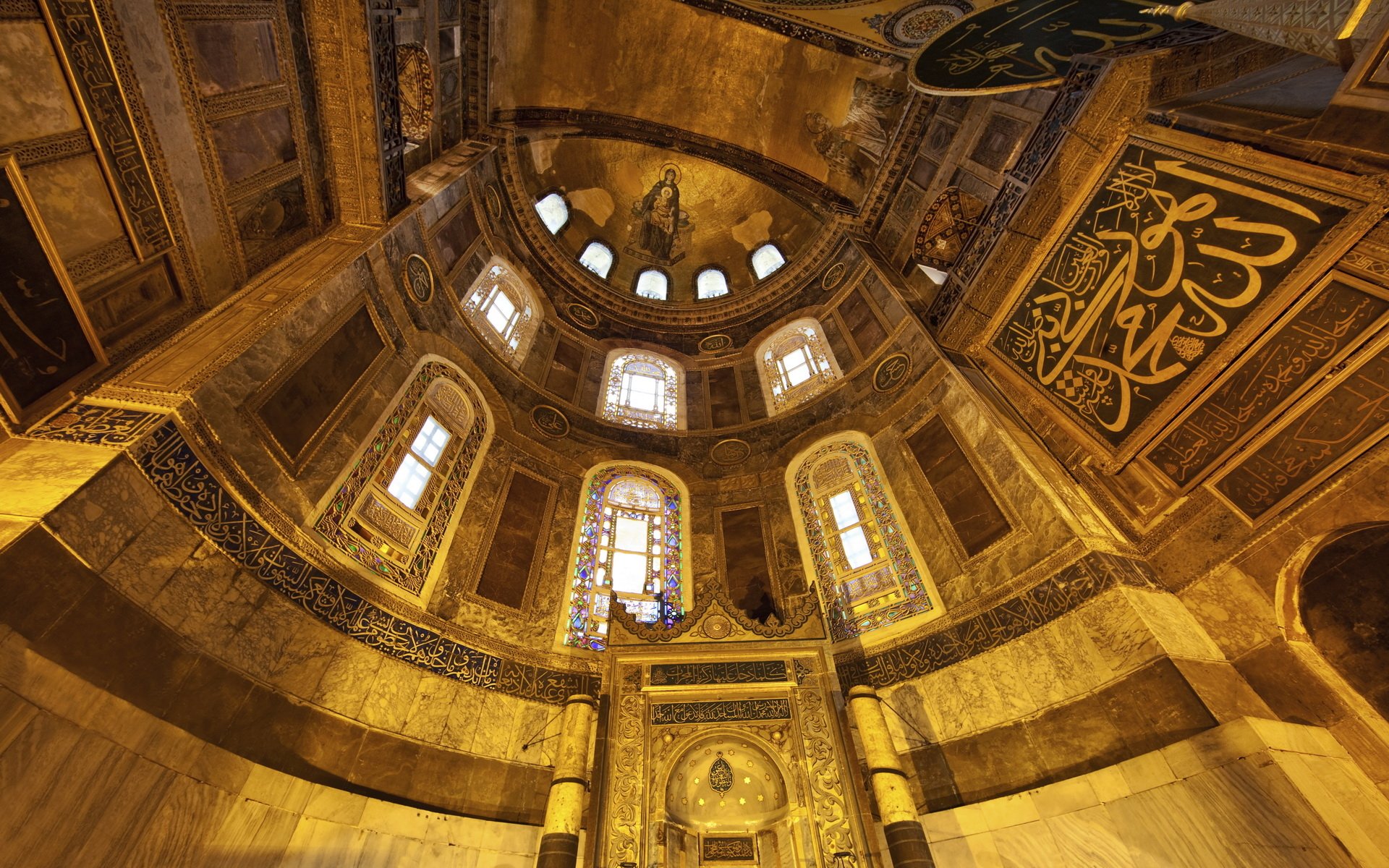 An HD wallpaper showcasing the stunning interior of Hagia Sophia, featuring intricate architecture, ornate decorations, and captivating stained glass windows.