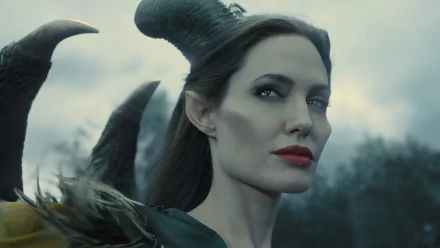 Angelina Jolie portrayed Maleficent, featuring striking horns and an enchanting expression in this captivating 4K Ultra HD desktop wallpaper.