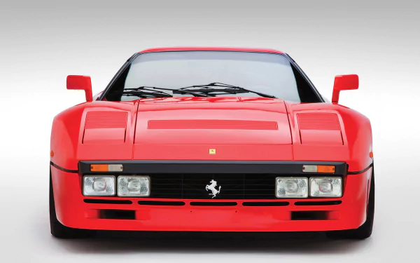 Front view of a red Ferrari 288 GTO sports vehicle on a clean gradient background, HD PC desktop wallpaper.