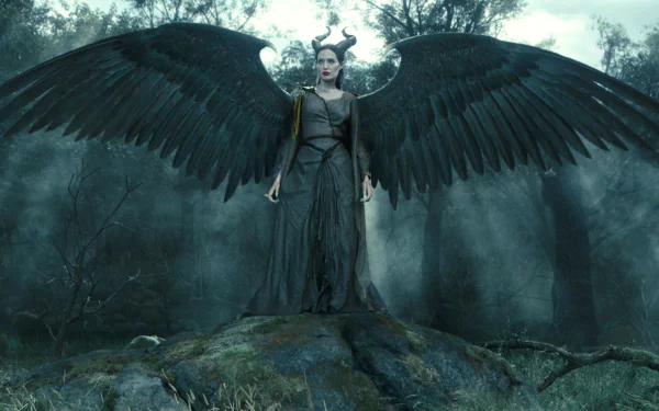 A stunning HD wallpaper featuring Angelina Jolie as Maleficent, showcasing her powerful presence with majestic wings in a dark, enchanted forest setting.
