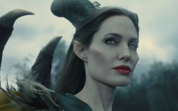 Angelina Jolie portrayed Maleficent, featuring striking horns and an enchanting expression in this captivating 4K Ultra HD desktop wallpaper.