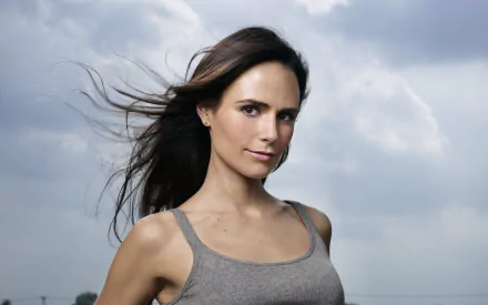 HD PC desktop wallpaper featuring Brazilian actress and celebrity Jordana Brewster against a cloudy sky background.