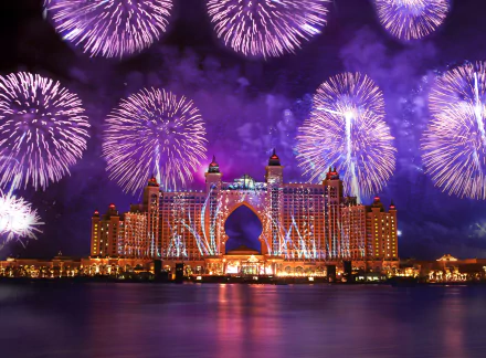 Vibrant fireworks illuminate the night sky above Atlantis, The Palm in Dubai, creating a stunning celebration of light and color against the luxurious hotel backdrop.