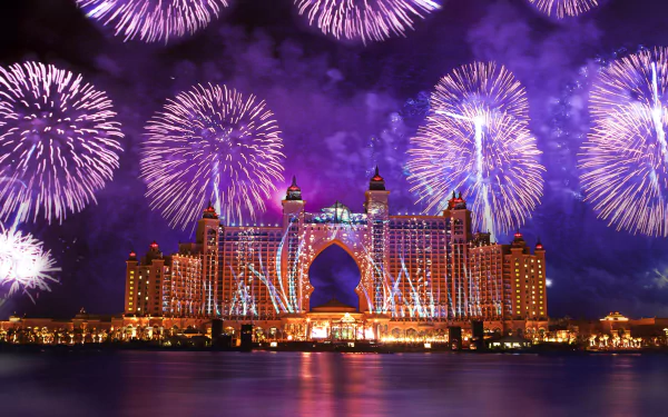 Vibrant fireworks illuminate the night sky above Atlantis, The Palm in Dubai, creating a stunning celebration of light and color against the luxurious hotel backdrop.
