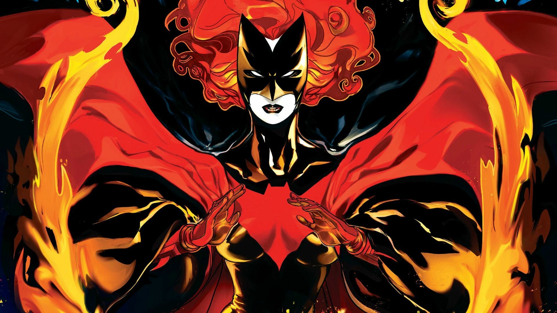 HD PC desktop wallpaper/background: comic Batwoman in a red-and-black suit with fiery flowing hair and cape, hands forming a bat symbol amid stylized flames on a dark backdrop.