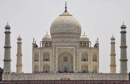 HD wallpaper featuring the iconic Taj Mahal in Agra, Uttar Pradesh, India, showcasing its stunning man-made architecture against a clear sky.