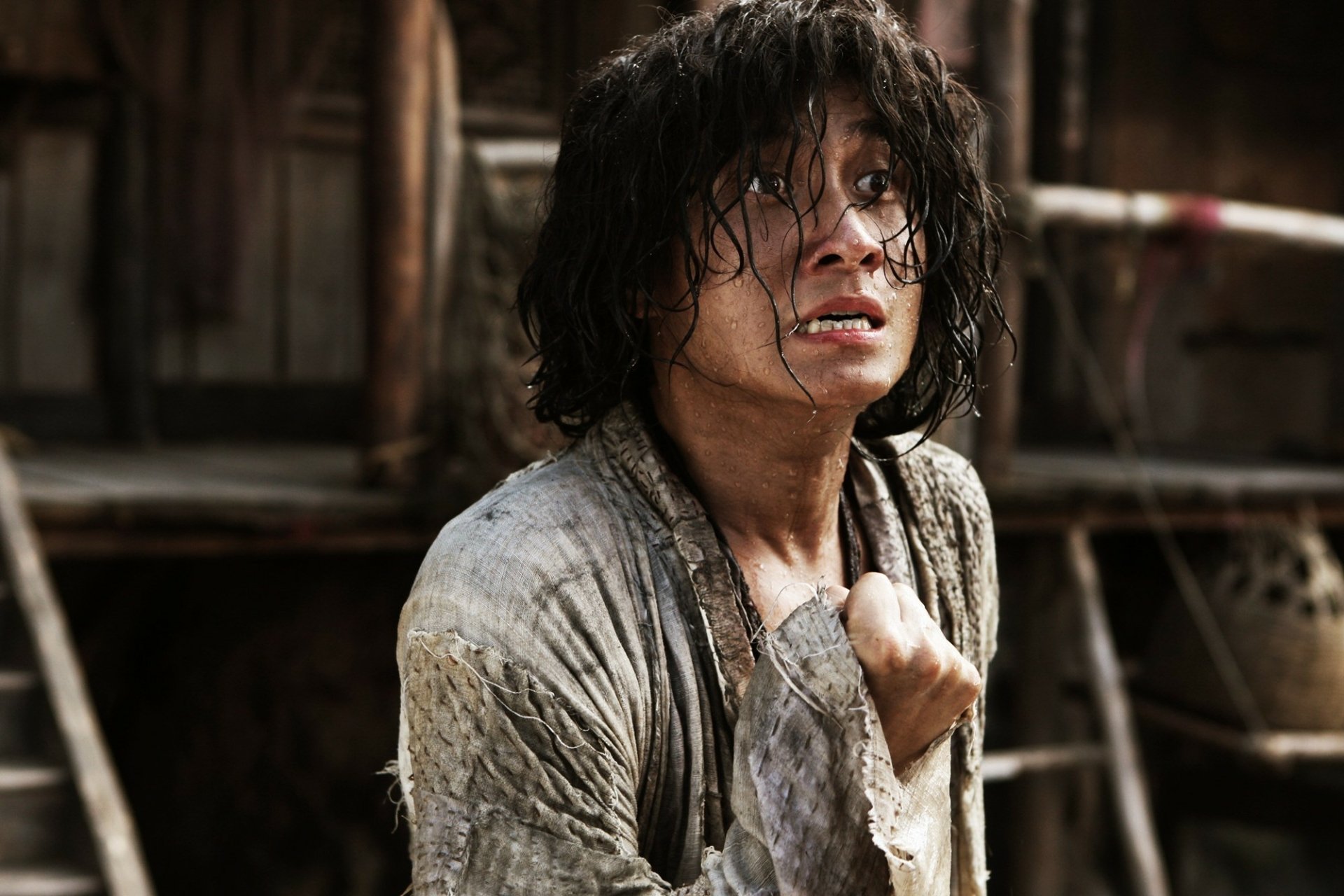 A compelling scene from Journey To The West, featuring a distressed character amidst a gritty backdrop, makes for an engaging HD desktop wallpaper.