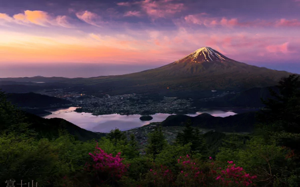 Scenic view of Mount Fuji at sunset in Japan, with vibrant sky and tranquil lake, captured in an HD nature wallpaper.
