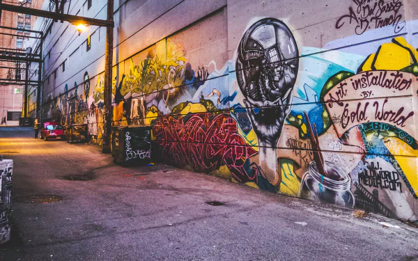 HD desktop wallpaper featuring a vibrant graffiti-covered alleyway.
