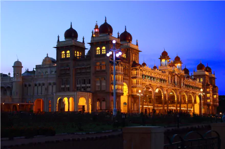 Mysore Palace in Karnataka, India, illuminated at dusk showcasing its intricate man-made architecture in a stunning 4K Ultra HD view.