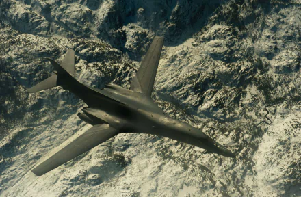 HD desktop wallpaper featuring a military Rockwell B-1 Lancer aircraft flying over rugged mountainous terrain.