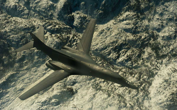HD desktop wallpaper featuring a military Rockwell B-1 Lancer aircraft flying over rugged mountainous terrain.