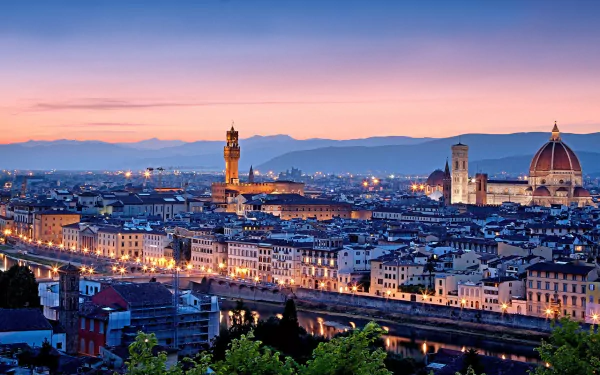 A stunning HD wallpaper showcasing Florence, Italy, at sunset, highlighting its iconic architecture and vibrant streets along the Arno River in Tuscany.