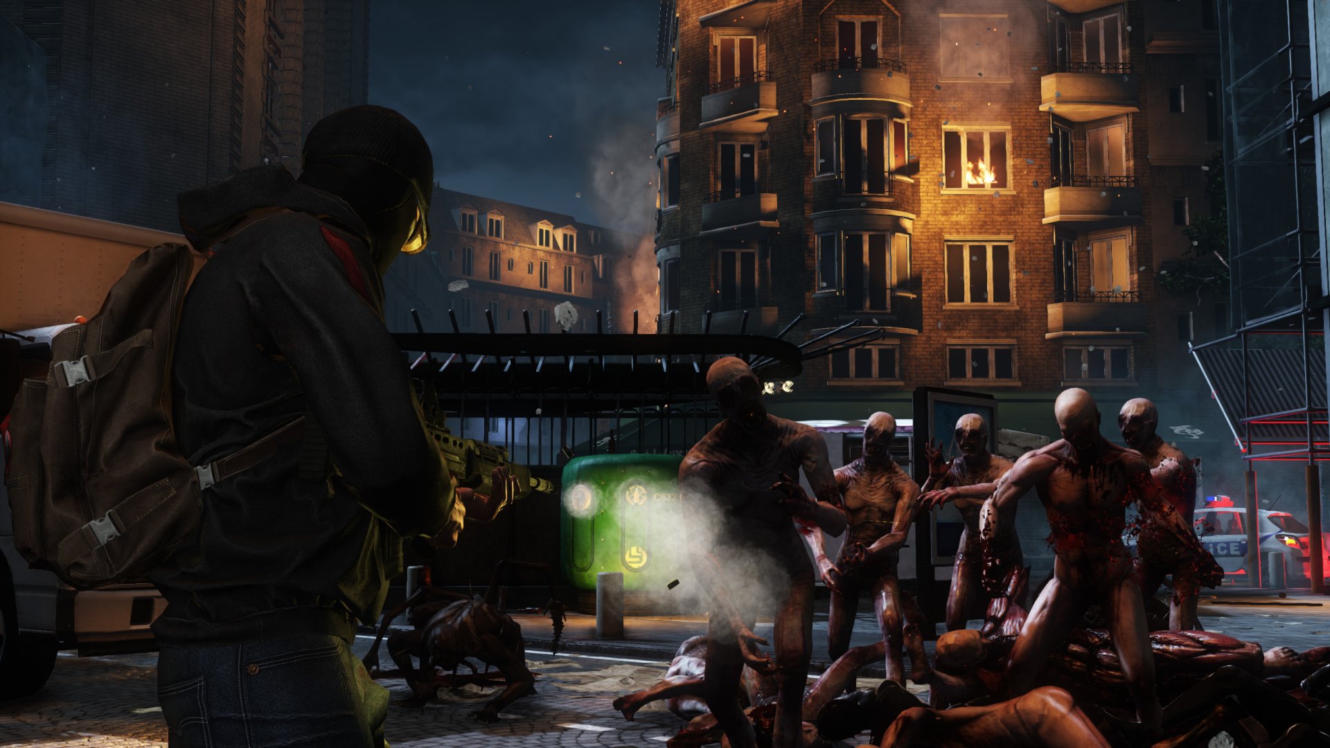 HD PC desktop wallpaper from the video game Killing Floor 2, depicting a character facing a horde of grotesque zombies in a dark, urban environment at night.