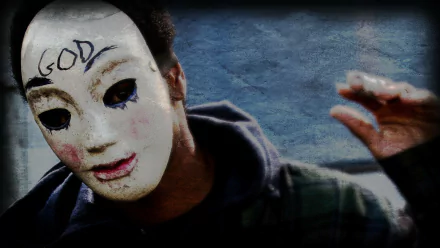 HD PC desktop wallpaper featuring a character wearing a white mask with GOD written on the forehead, inspired by the movie The Purge.