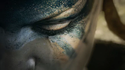 Close-up of Senua's face from the video game Hellblade: Senua's Sacrifice, featured in an HD PC desktop wallpaper and background.