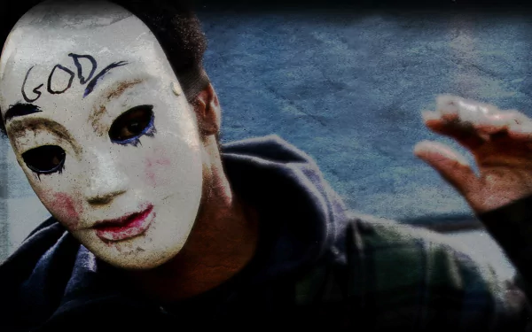 HD PC desktop wallpaper featuring a character wearing a white mask with GOD written on the forehead, inspired by the movie The Purge.