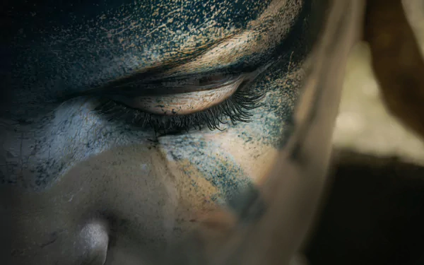 Close-up of Senua's face from the video game Hellblade: Senua's Sacrifice, featured in an HD PC desktop wallpaper and background.
