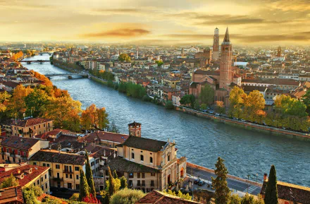 Autumn sunset over the historic city of Verona, Italy, showcasing its river and iconic architecture in a vibrant HD desktop wallpaper.