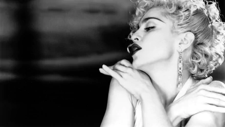 Black and white HD desktop wallpaper featuring Madonna in a dramatic pose, capturing her iconic music persona and bold style.