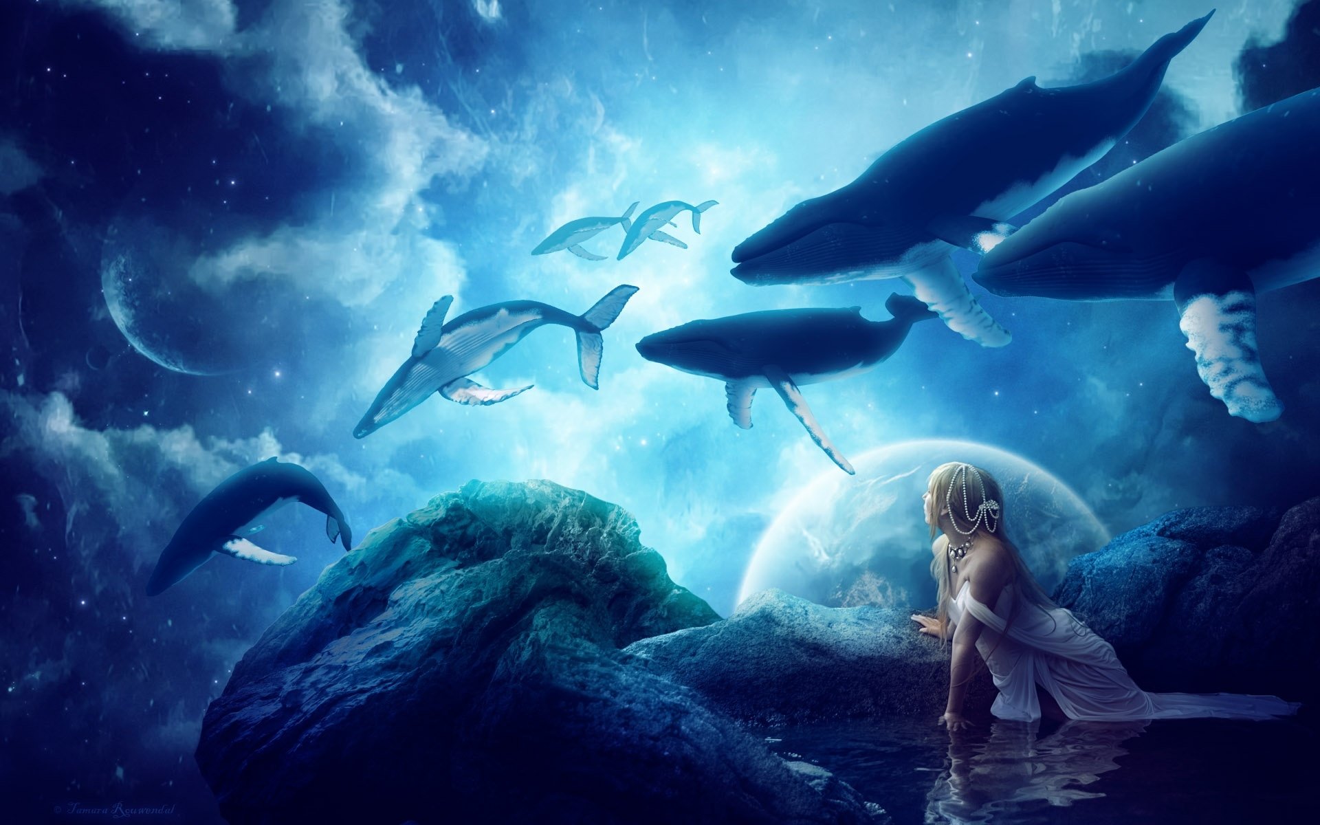 A serene fantasy scene featuring a figure by water, surrounded by majestic whales under a starry sky, creating a magical and otherworldly atmosphere. HD wallpaper for PC.