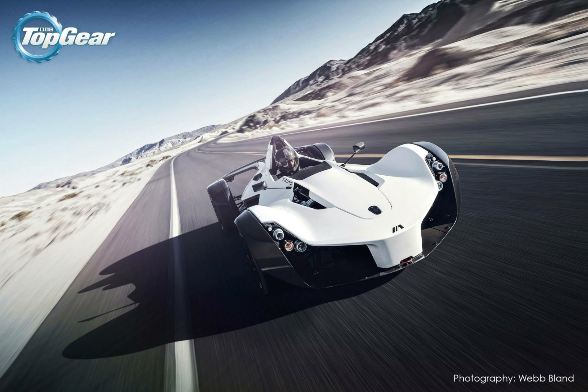 Sleek white BAC Mono race car speeding down a desert road, featured as an HD desktop wallpaper from the Top Gear TV show.