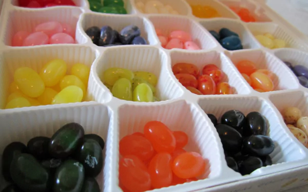 Close-up of a colorful assortment of jelly beans neatly organized in a box, captured as an HD PC desktop wallpaper and background.