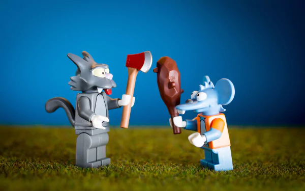 HD PC desktop wallpaper featuring Lego figures of Itchy & Scratchy from The Simpsons, with Itchy holding an axe and Scratchy holding a drumstick.