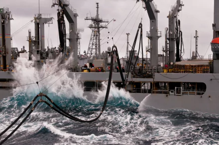USNS Yukon (T-AO-202) replenishment oiler conducting at-sea refueling operations with military vessels, captured in dynamic 4K Ultra HD detail.