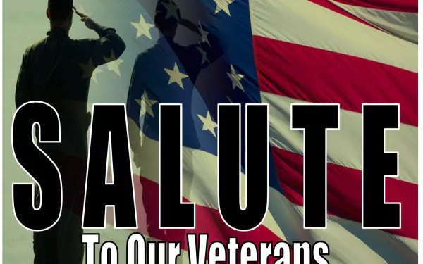 HD PC desktop wallpaper for Veterans Day holiday: silhouetted servicemembers saluting before a large American flag with bold text SALUTE To Our Veterans.