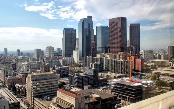 A panoramic view of downtown Los Angeles showcasing towering skyscrapers and urban development, captured in a high-definition desktop wallpaper.