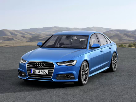A blue Audi A6 parked on a road with mountainous terrain in the background, captured in 4K Ultra HD as a PC desktop wallpaper.