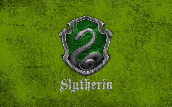 HD desktop wallpaper featuring the Slytherin crest from the Harry Potter movie series. The crest shows a silver snake on a green textured background with the word 'Slytherin' below it.