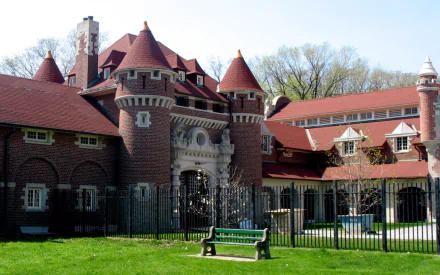 HD PC desktop wallpaper/background: Casa Loma, a man-made brick castle with red turrets, arched entrance and green lawn under a clear sky.