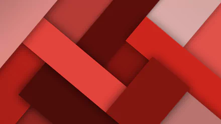 Abstract design featuring varying shades of red, with overlapping geometric shapes creating a dynamic visual effect. This striking artwork serves as a vibrant 4K Ultra HD desktop wallpaper.