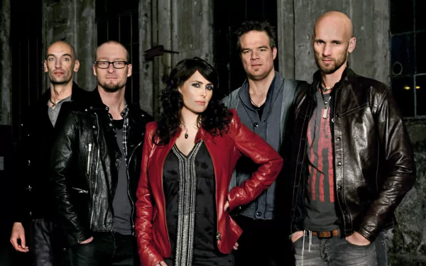 HD PC desktop wallpaper and background: moody music band portrait of five members in leather jackets posed against a dark, gritty industrial backdrop.